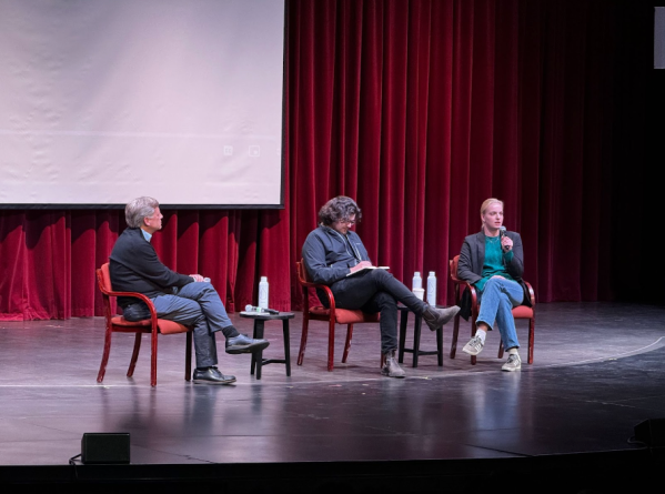 From left to right, former ambassador to Russia Michael McFaul, filmmaker Daniel Roher, and Dasha Navalnaya ’24 sitting on a stage discussing a screening of Navalny.